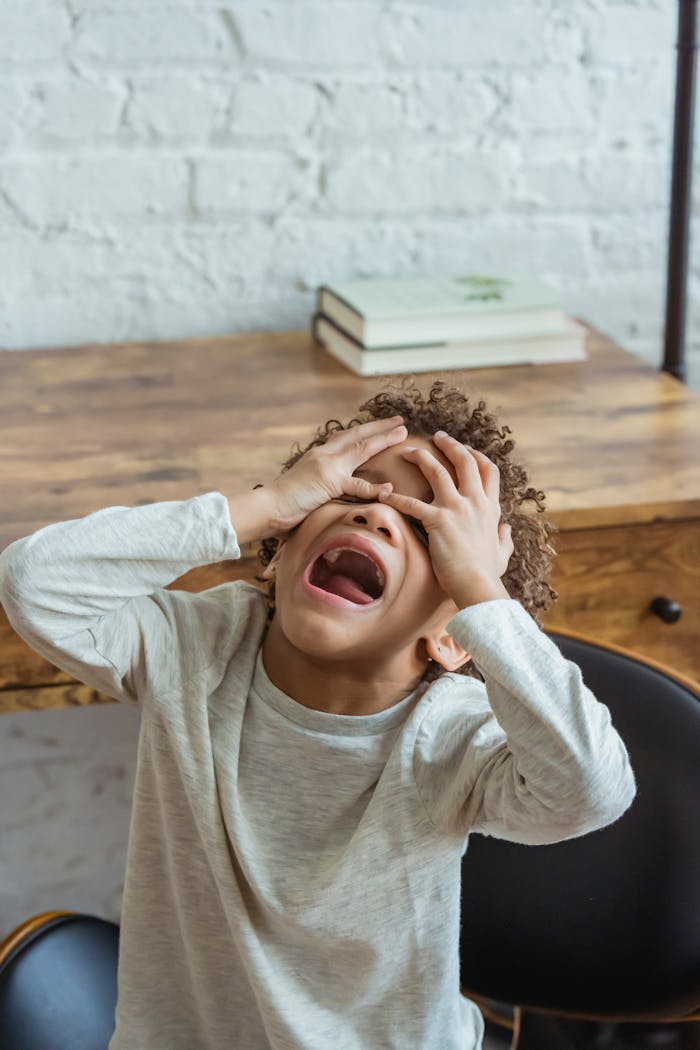 Black boy screaming in room